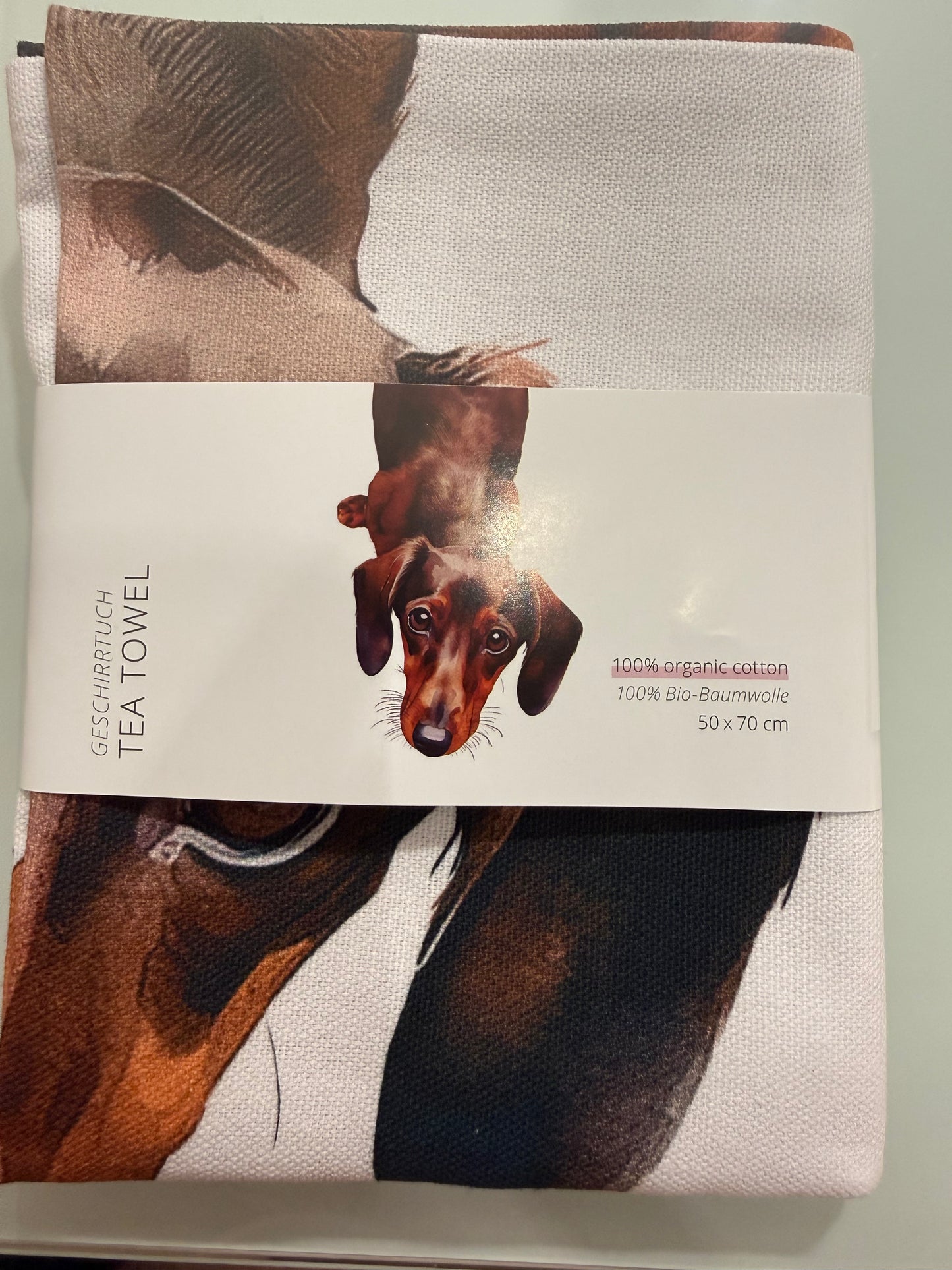 Verschiedene Geschirrtücher mit Motiv oder Text